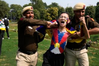 Tibetans scuffle with police outside the Chinese Embassy in India as they mark uprising anniversary