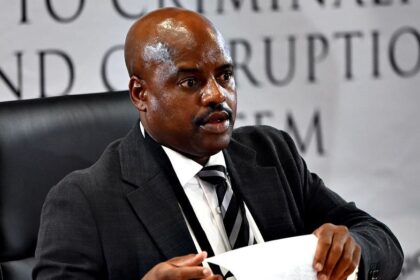 South African ex-police chief gets tissue stuck on forehead while sweating during corruption inquiry